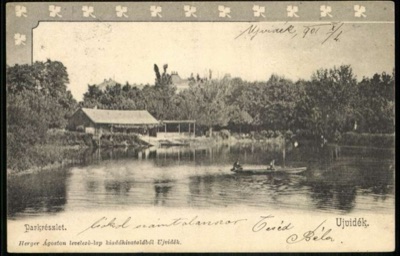 A lake in the park, with a rowing boat, Danube Park, Novi Sad, by October 1901