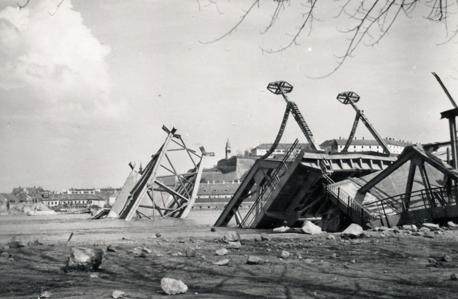 Remains of the destroyed road bridge, with Petrovaradin behind, Prince Tomislav Bridge, Novi Sad, 1941