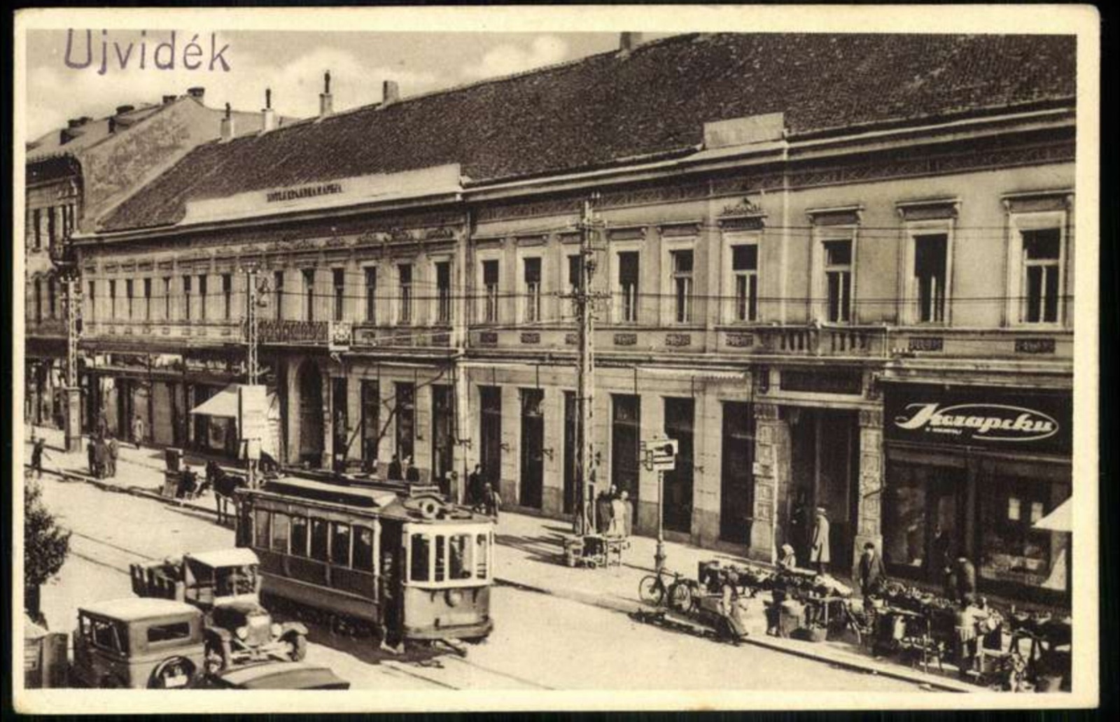 The Queen Mary Hotel's Shopfronts, with a Tram and Motor Cars, Hotel Queen Mary, Novi Sad, 1919–1941