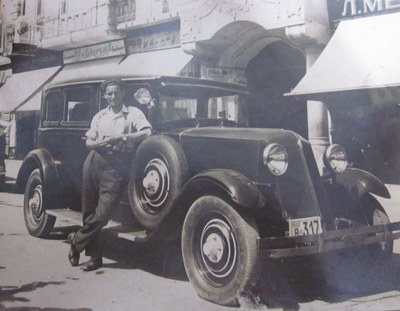 Next to the car in King Alexander Street, Novi Sad, 1933